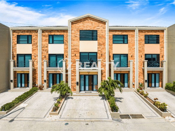 Front view of the Porta al Sole townhouses, showing the brick facade and three-story design of Unit 8.