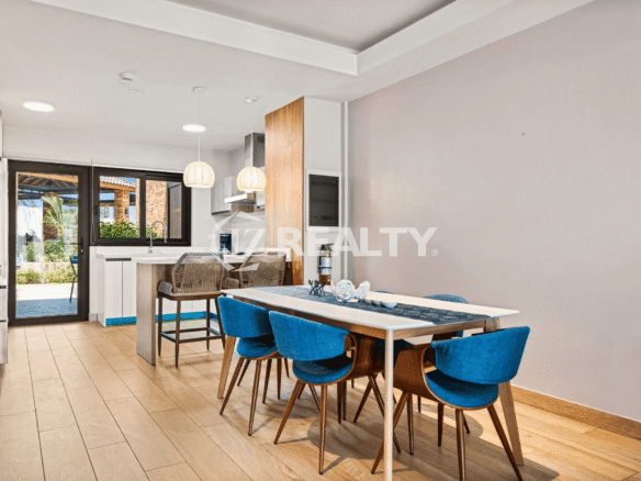 Open concept view of the Kitchen and Dining Area on Floor 1 of Porta al Sole Unit 8, with access to the outdoor patio.
