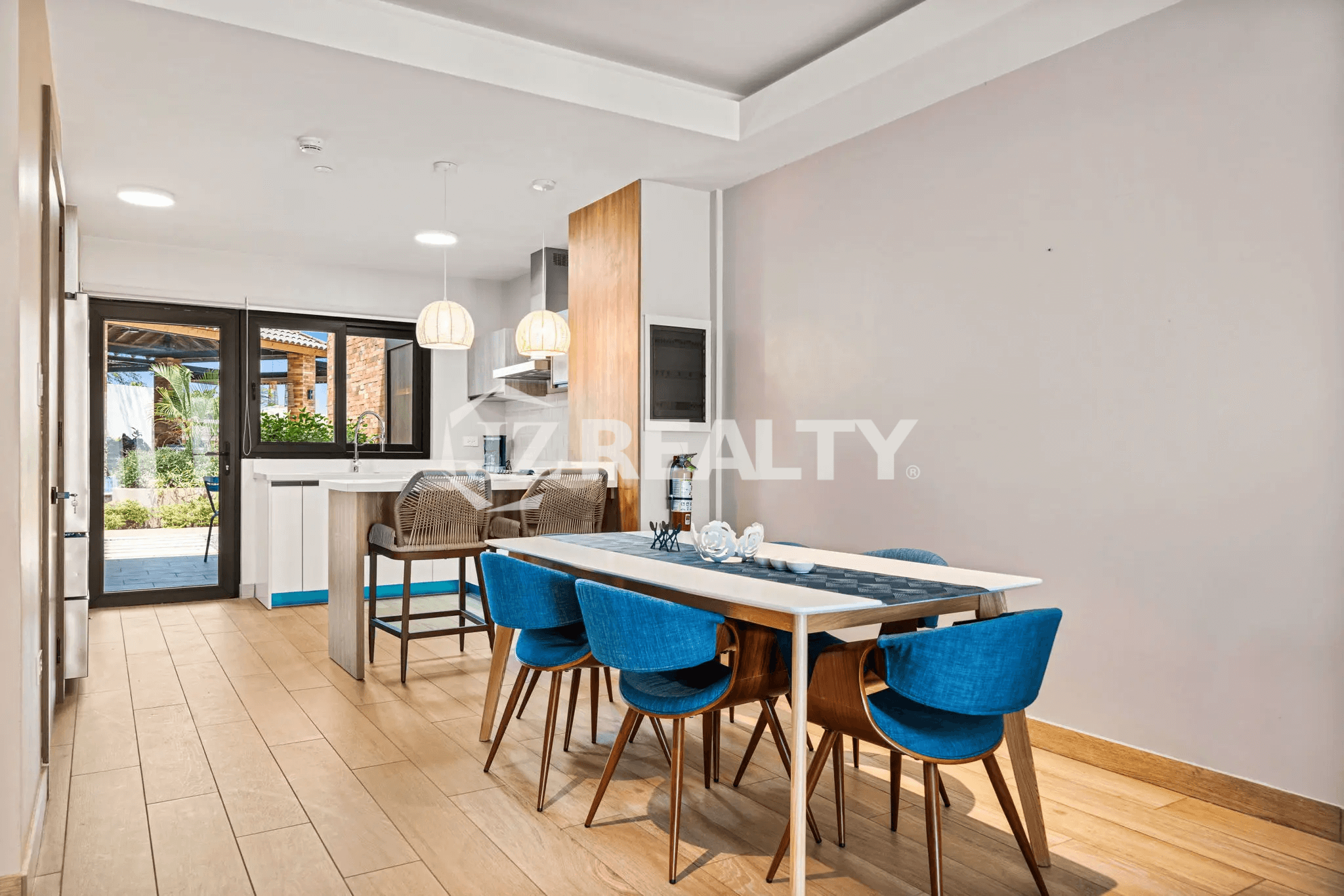 Open concept view of the Kitchen and Dining Area on Floor 1 of Porta al Sole Unit 8, with access to the outdoor patio.