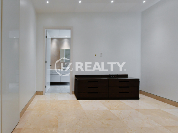 Coral Shell Condo 1E & 2E luxury loft bedroom with glossy marble flooring and minimalist design.