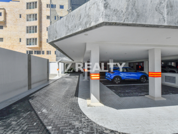 A secure and well-lit covered parking area at Coral Shell Condo in Aruba, ensuring residents and guests have convenient and safe vehicle storage.