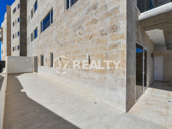 A spacious private terrace at Coral Shell Condo in Aruba, designed for relaxation and entertainment with a seamless indoor-outdoor living experience.