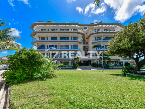 Luxury beachfront condominium in Aruba with modern architecture and glass balconies, Coral Shell Aruba.