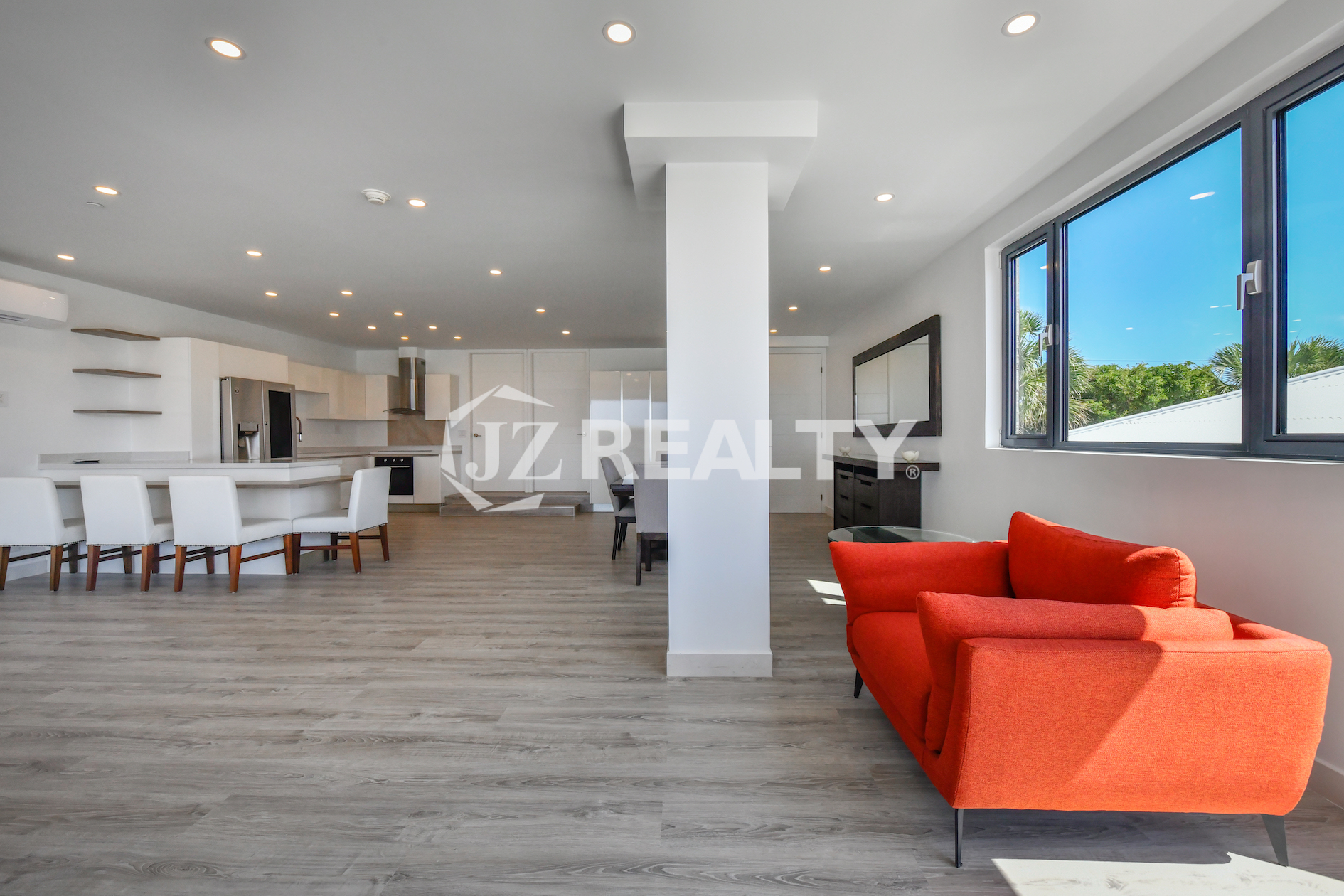 Open-layout living space with modern furnishings in Coral Shell Condo 1H, Aruba.