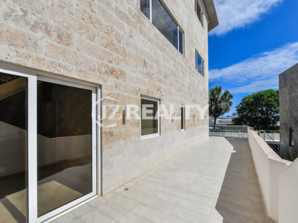 Coral Shell Condo’s natural coral stone facade in Oranjestad, Aruba, providing a stylish and thermally efficient exterior.