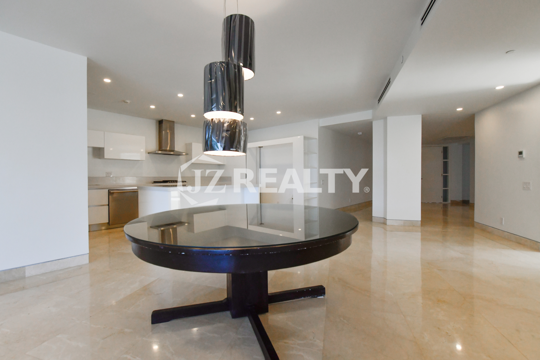 Stylish luxury bathroom with glass-enclosed shower and floating vanity at Coral Shell Condo GF-C, Oranjestad, Aruba.