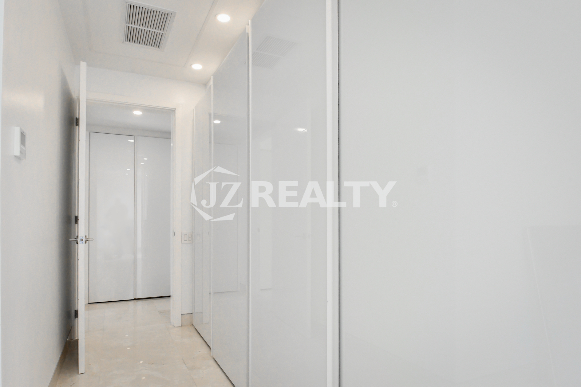 Sleek hallway with modern built-in closets at Coral Shell Condo GF-C in Oranjestad, Aruba.