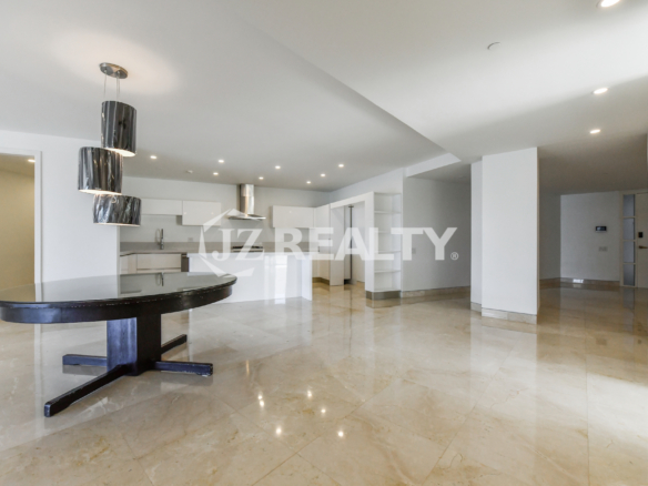 Luxurious bathroom at Coral Shell Condo GF-C with marble finishes and glass shower.