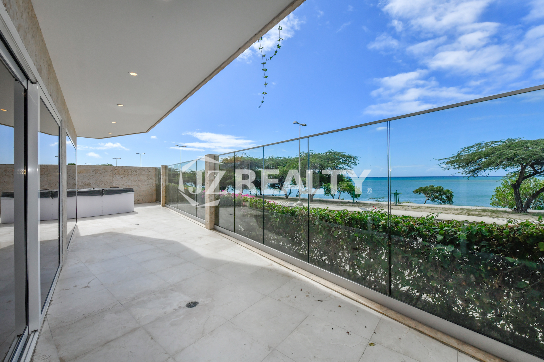 Private outdoor spa bathtub at Coral Shell Condo GF-C with oceanfront views.