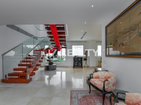 Spacious living area with contemporary art and stylish furnishings at Coral Shell Penthouse B, Aruba.
