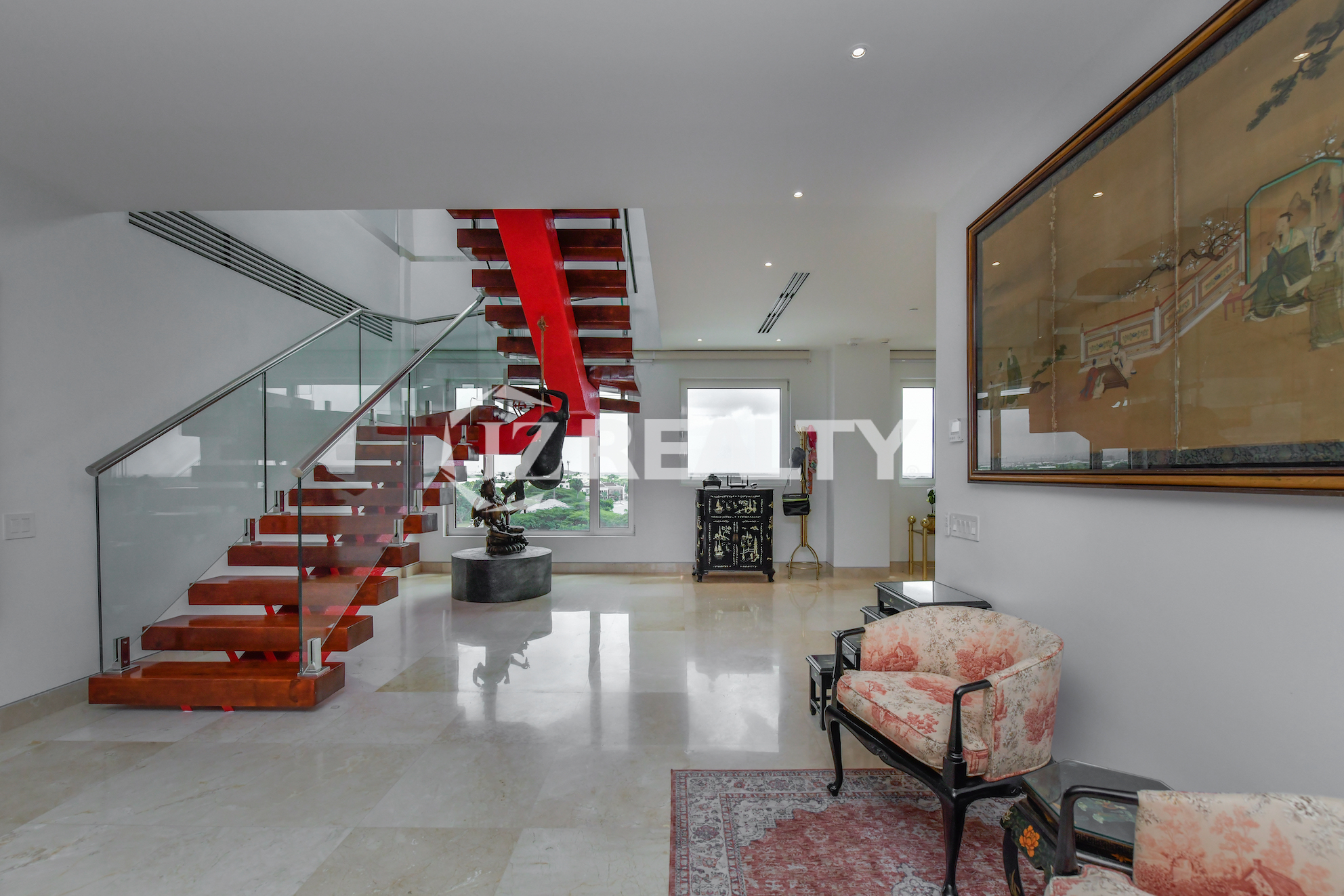 Spacious living area with contemporary art and stylish furnishings at Coral Shell Penthouse B, Aruba.