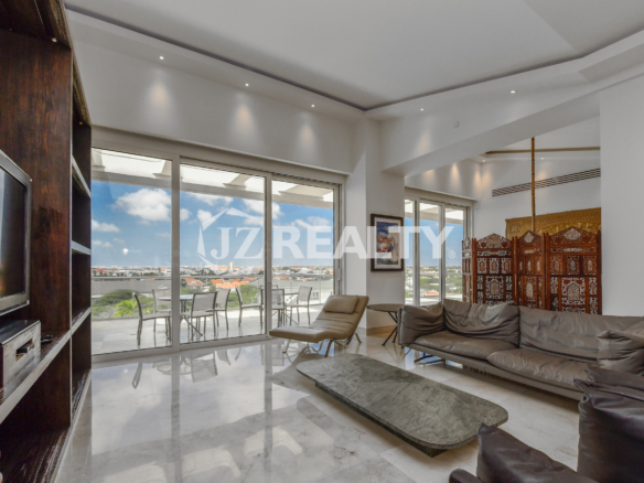 Elegant bathroom with modern fixtures and a spacious walk-in shower at Coral Shell Penthouse B.