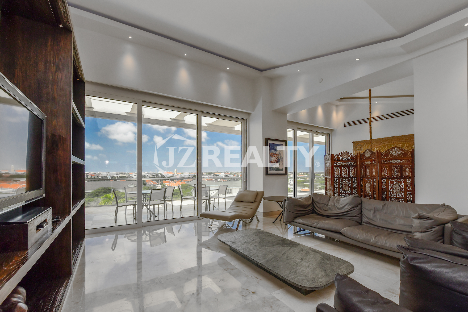 Elegant bathroom with modern fixtures and a spacious walk-in shower at Coral Shell Penthouse B.