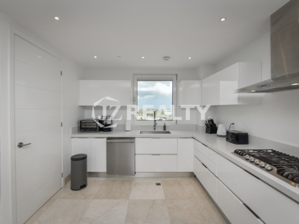 Stylish grand entrance with glass doors leading to the rooftop terrace at Coral Shell Penthouse B.