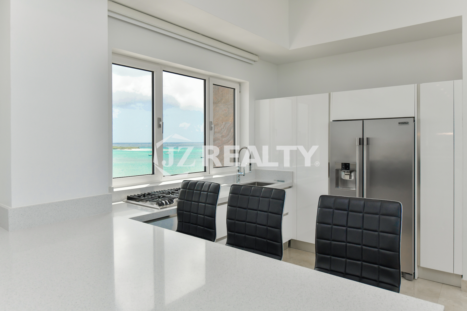 Private home theater with luxury red leather seating at Coral Shell Penthouse B.