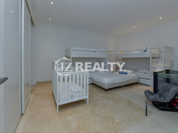 Comfortable and spacious kids' bedroom with bunk beds at Coral Shell Penthouse B, Aruba.