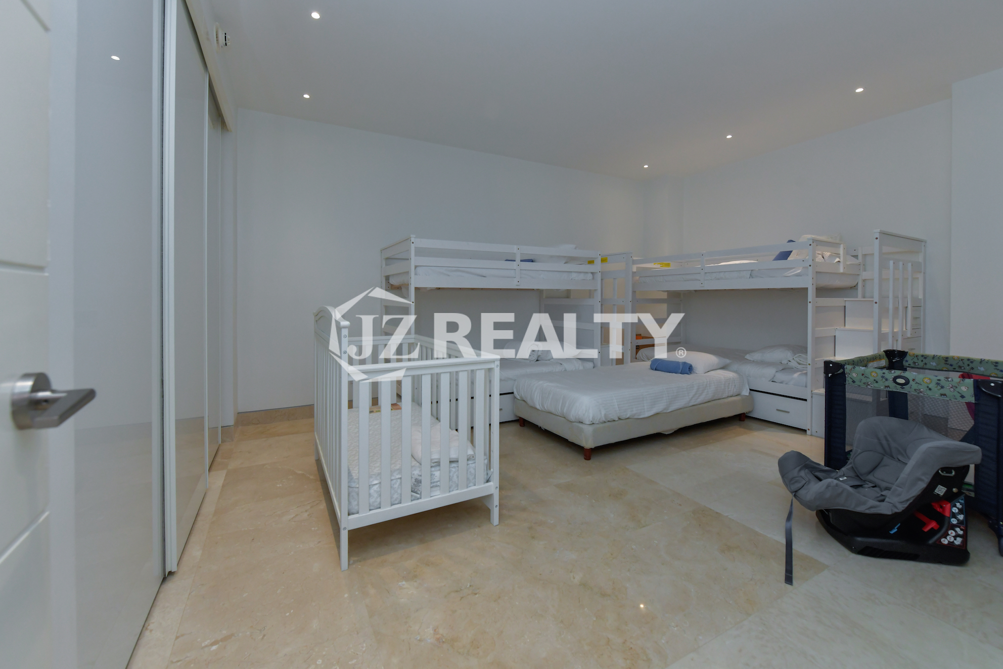 Comfortable and spacious kids' bedroom with bunk beds at Coral Shell Penthouse B, Aruba.