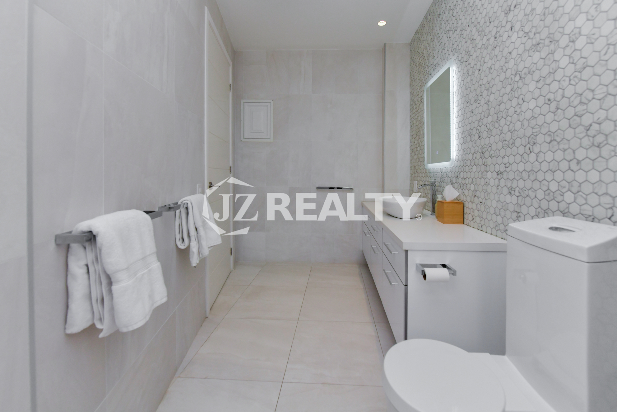 High-end luxury bathroom at Coral Shell Oceanfront Penthouse B, featuring a stylish modern design and premium finishes.