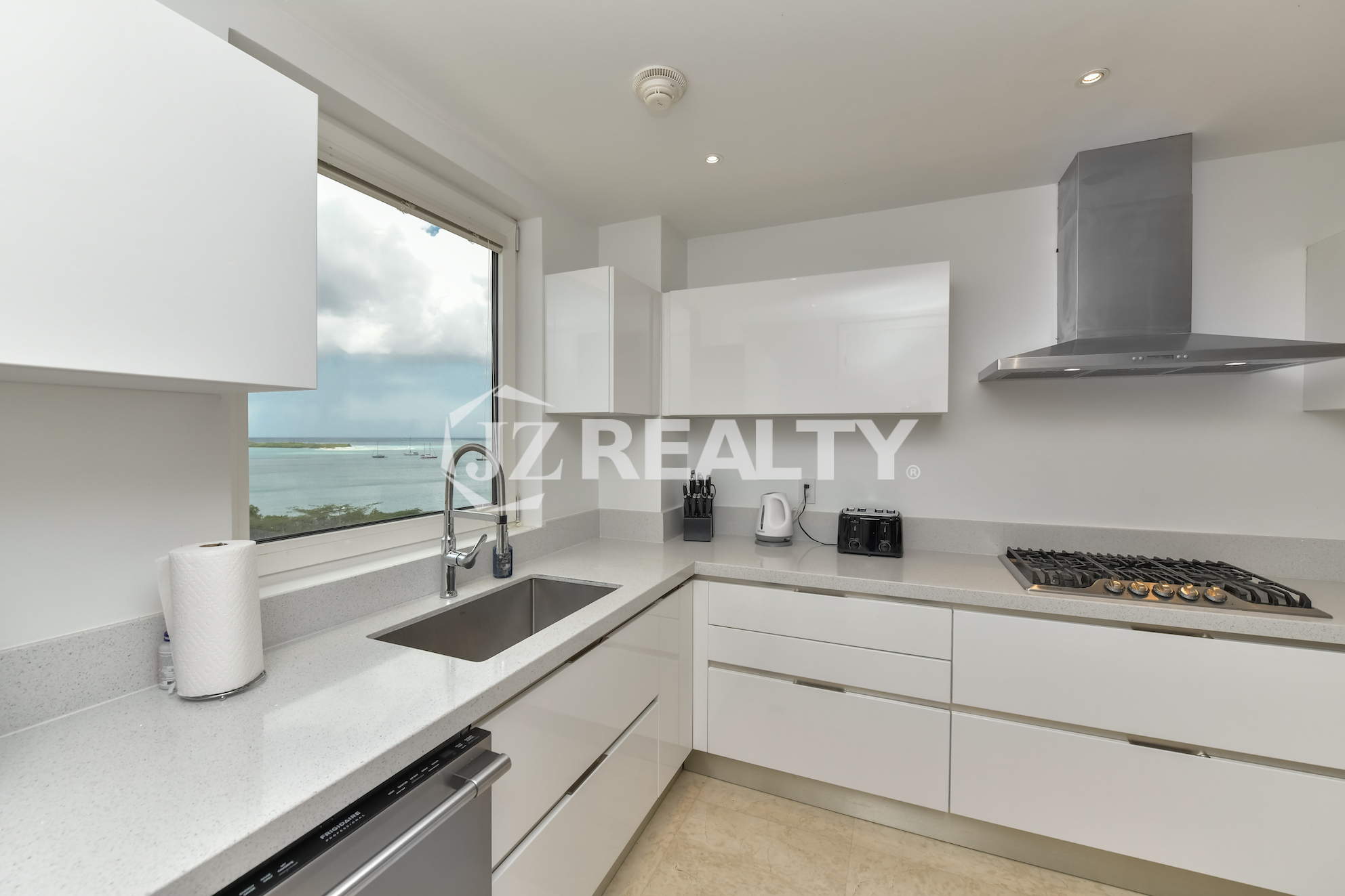 Modern kitchen with a stunning ocean view at Coral Shell Penthouse B.