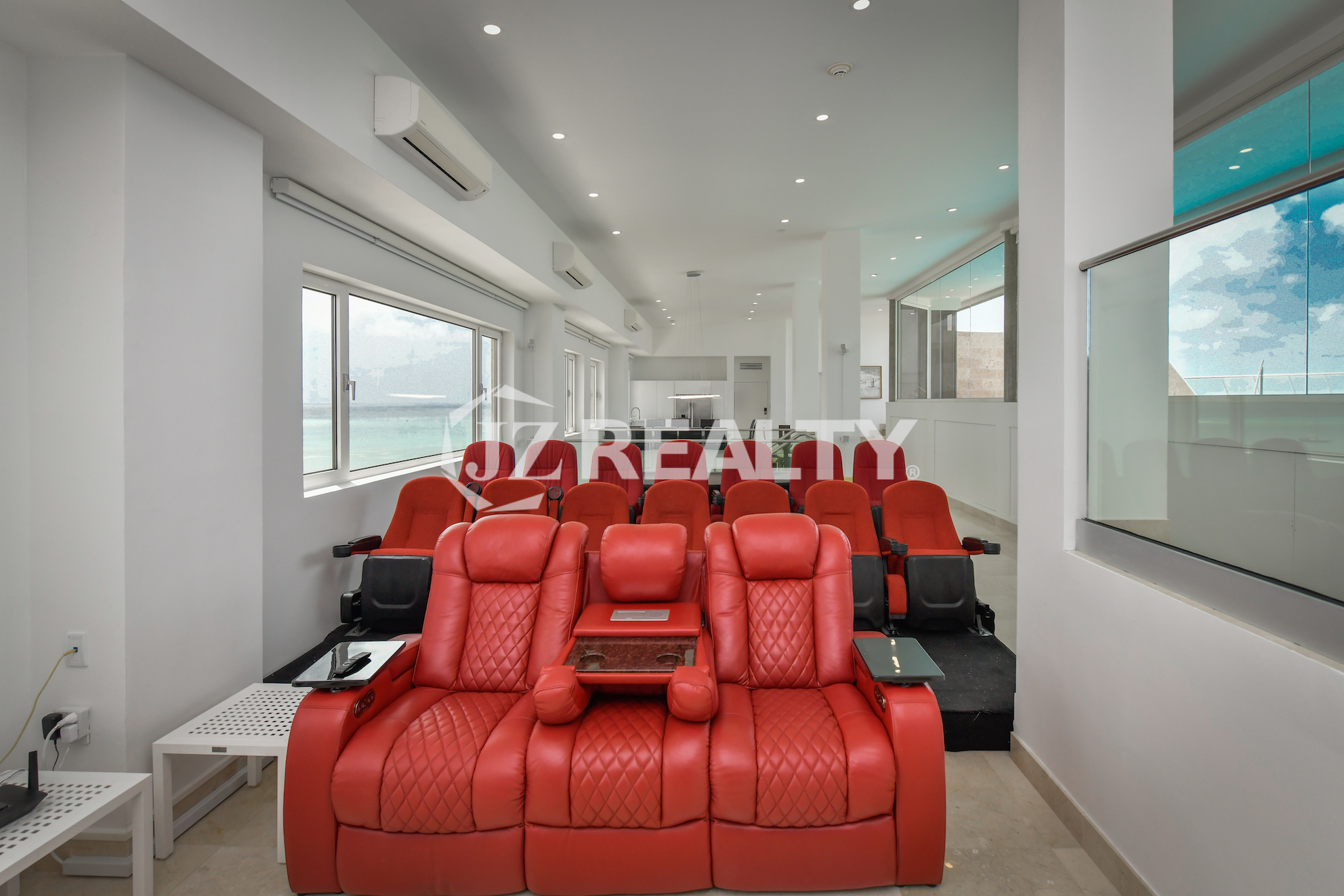 Private infinity pool with lounge seating and ocean views at Coral Shell Penthouse B.