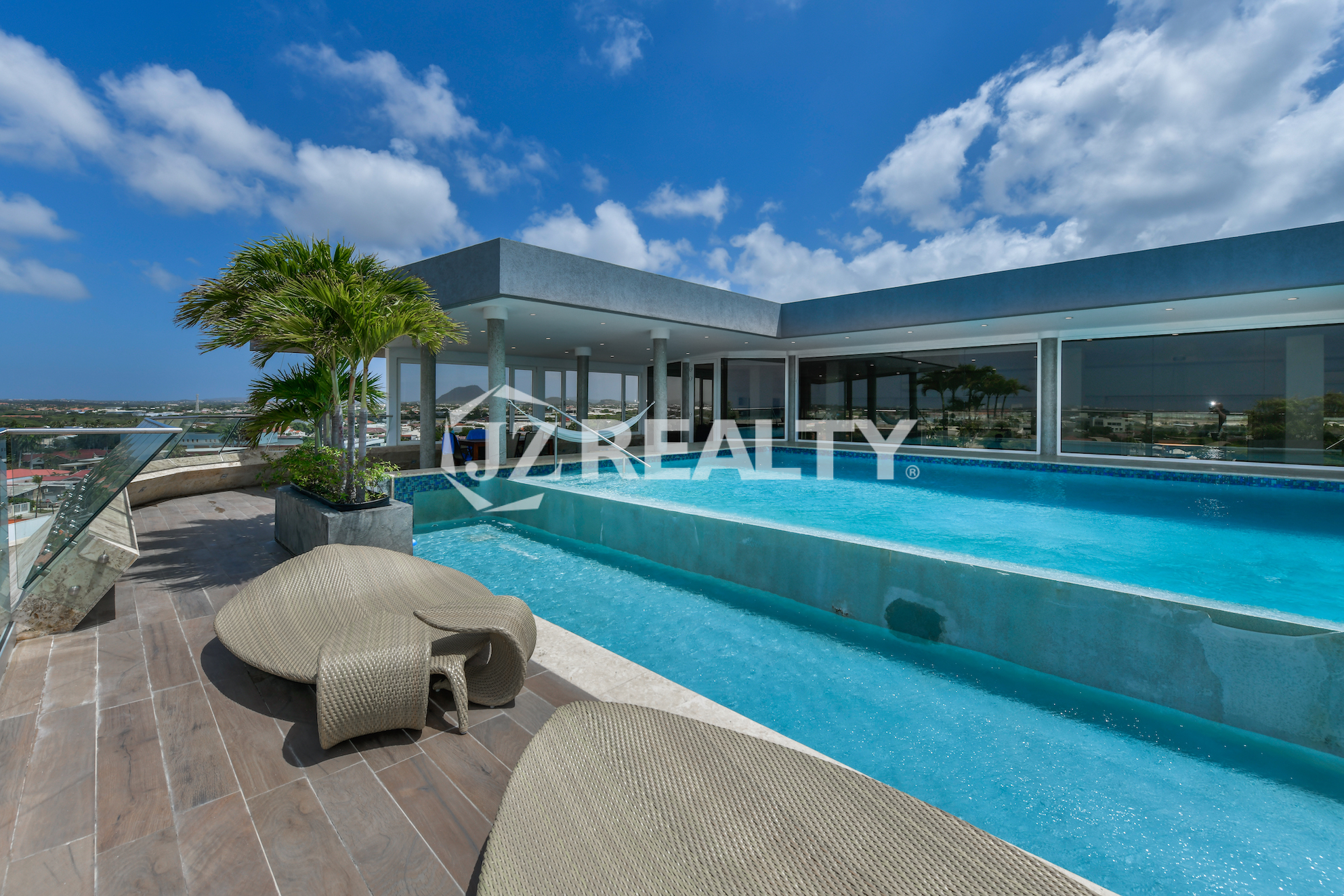 Private rooftop pool at Coral Shell Oceanfront Penthouse B in Aruba, offering a tranquil escape with stunning island views.