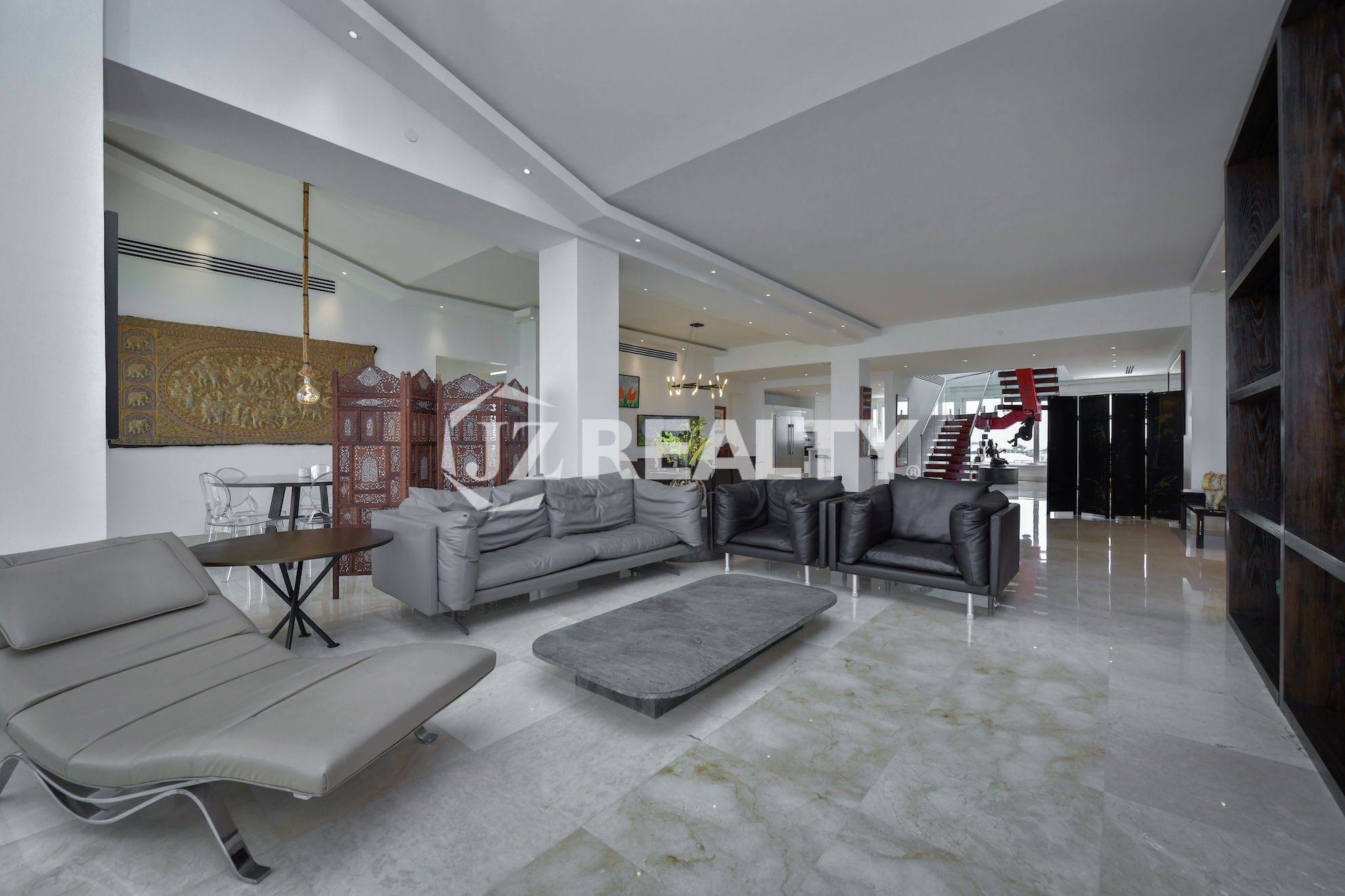Stylish and spacious lounge area with luxury seating at Coral Shell Penthouse B, Aruba.
