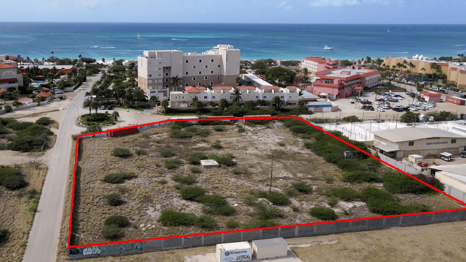 Aerial view of the outlined L’Aquila Residences development site near Eagle Beach, Aruba.