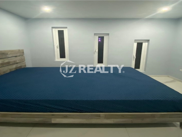 modern-aruba-bedroom-with-wooden-bedframe