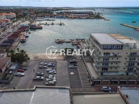 condo 211 building aerial view with marina and harbor