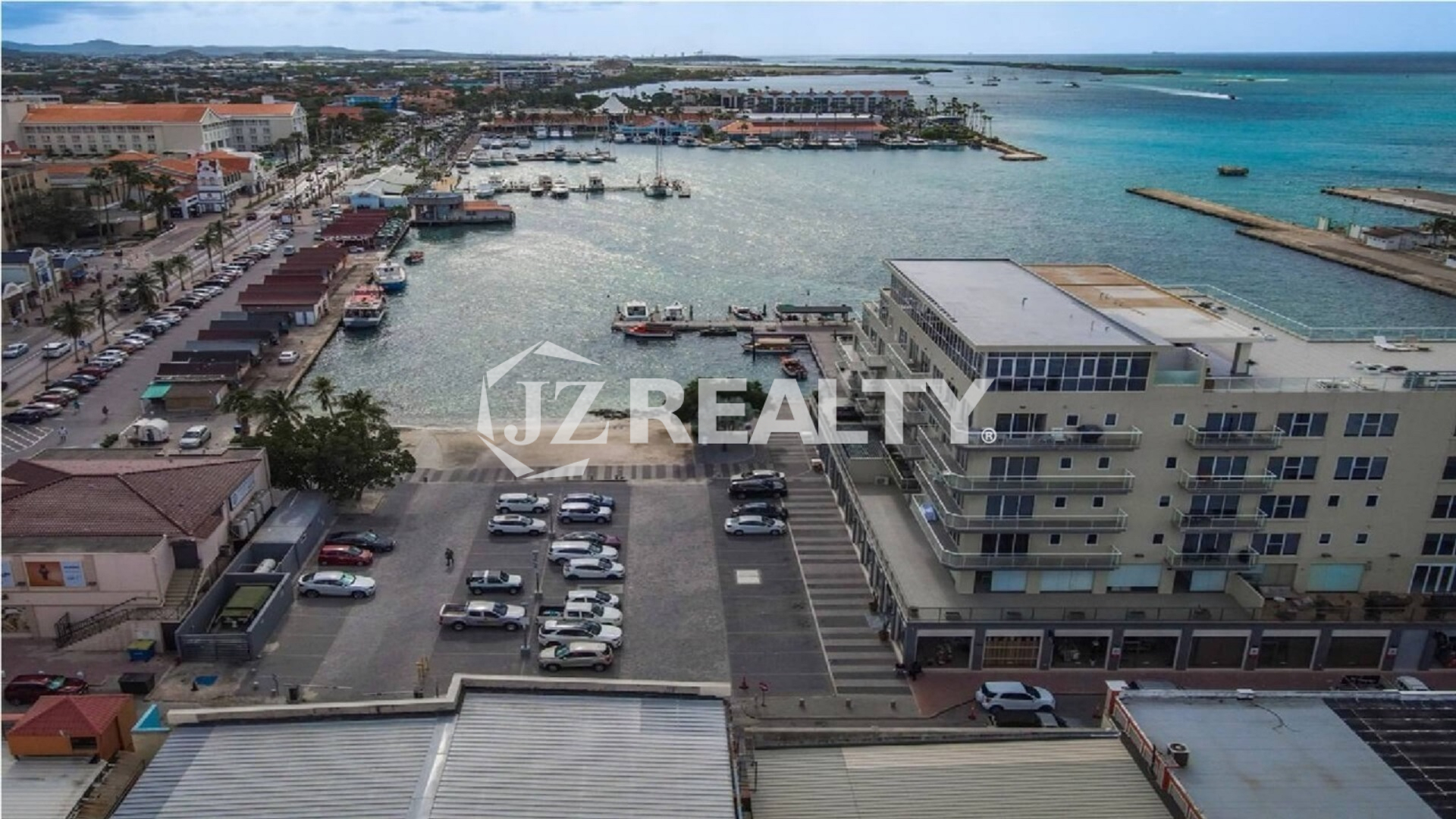 condo 315 building aerial view with marina and harbor
