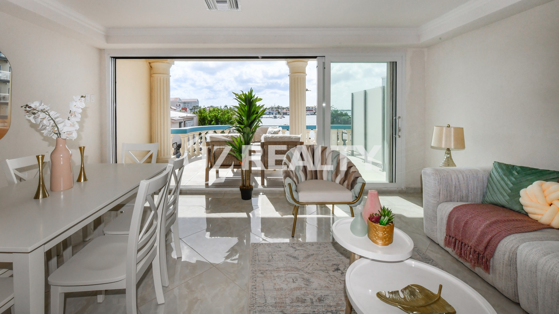 condo 213 living and dining area with harbor balcony views