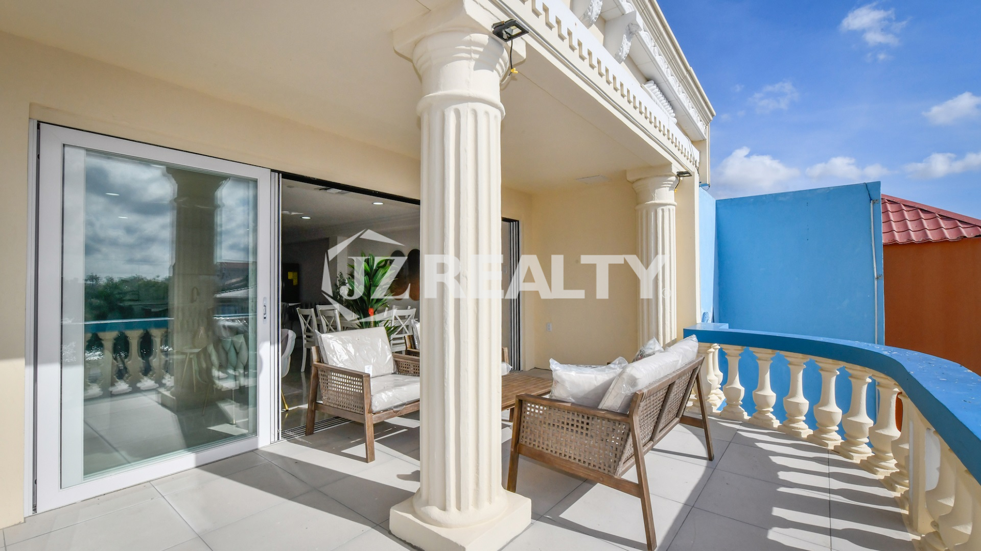 condo 213 Luxury waterfront covered balcony with wicker chairs & water views