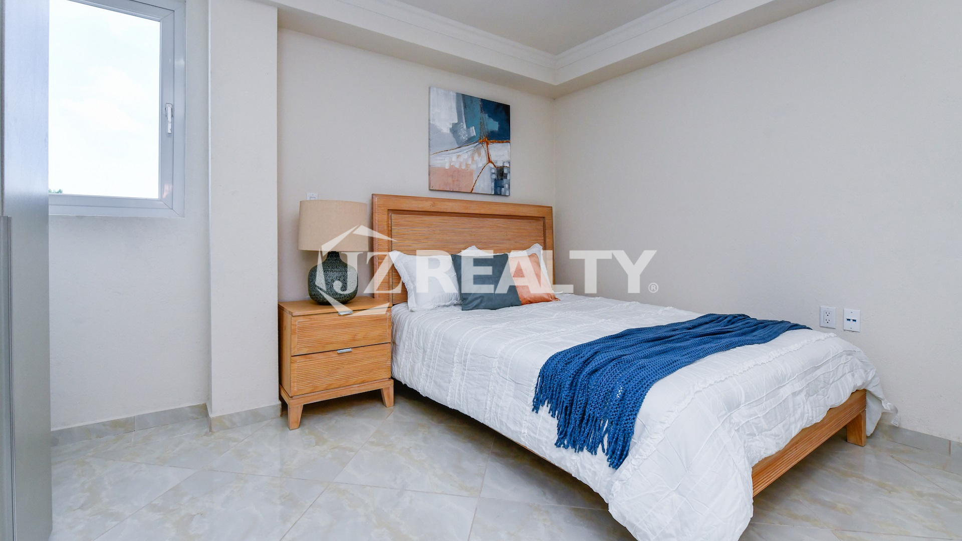 condo 213 master room with wooden furniture and natural light