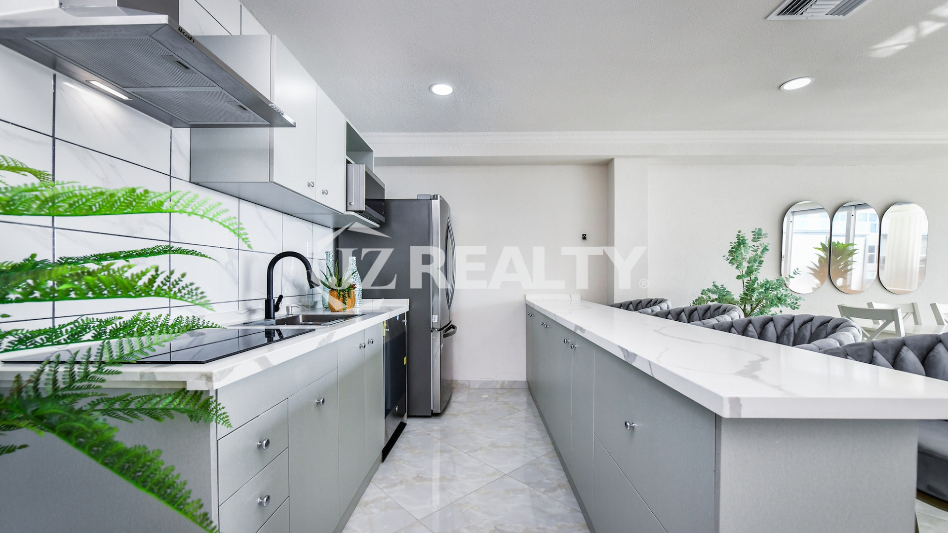 condo 213 modern galley kitchen with white cabinetry