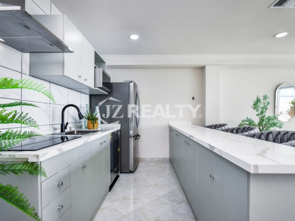 condo 214 modern galley kitchen with white cabinetry