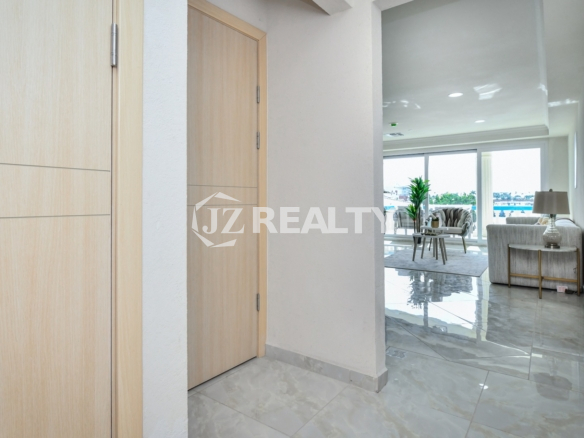 condo 216 entry hallway leading to living room and balcony