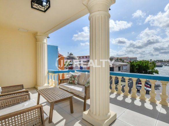 condo 216 balcony with wicker seating and marina views