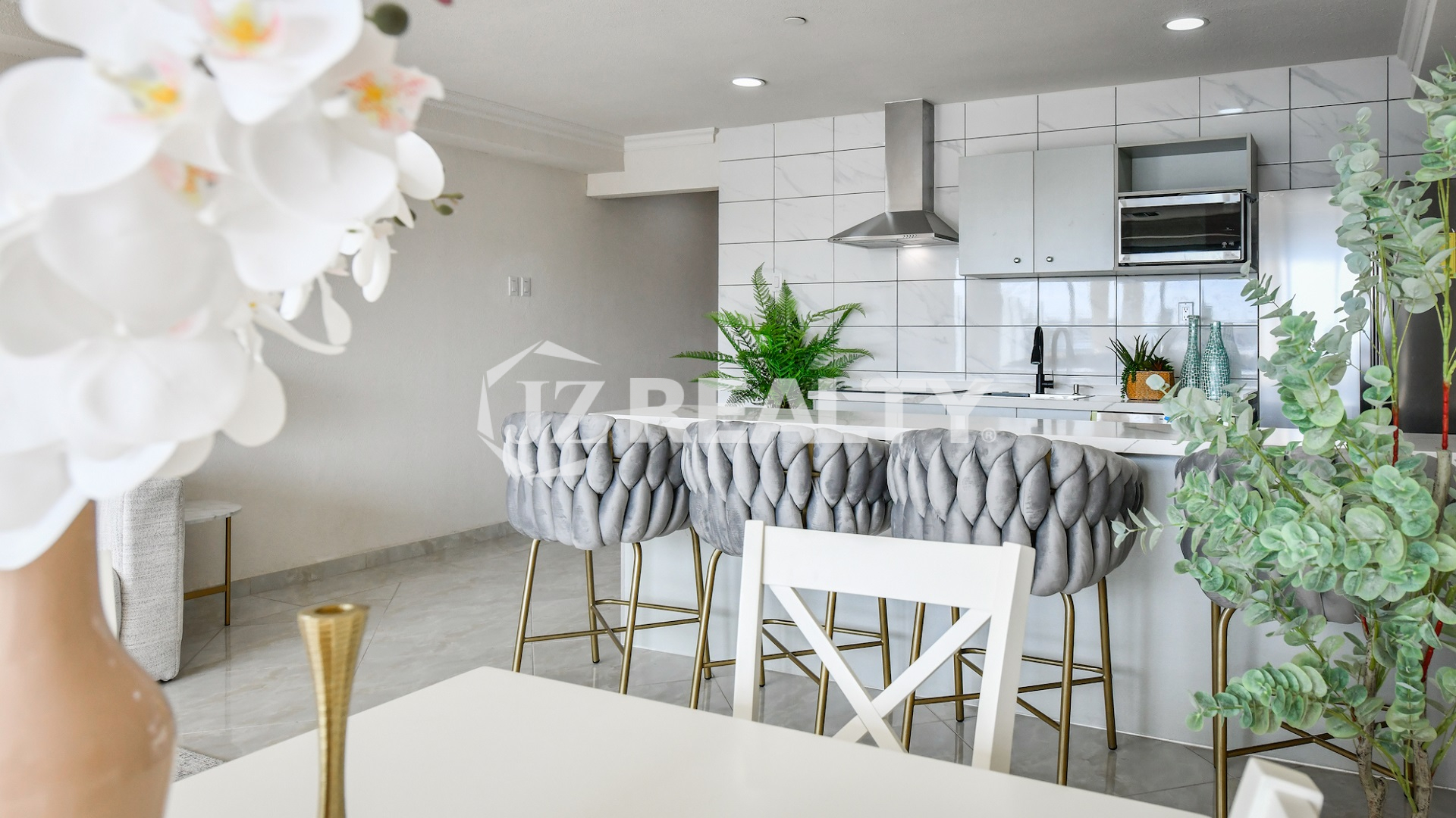 condo 312 open kitchen with bar seating and gray stools