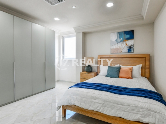 condo 313 master room featuring large built-in wardrobe storage