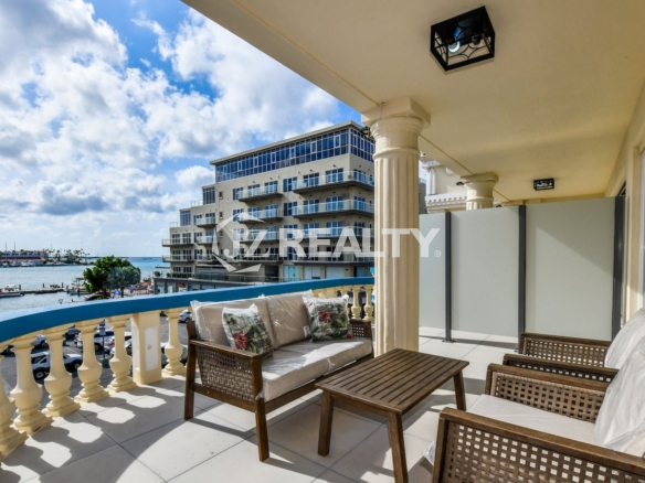 condo 313 balcony with wicker seating and marina views