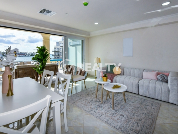condo 316 living room with balcony access and harbor views