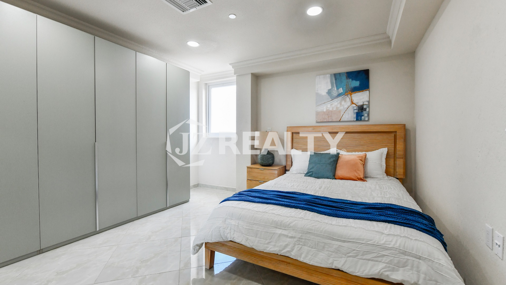 condo 314 master room featuring large built-in wardrobe storage