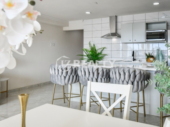 condo 314 open kitchen with bar seating and gray stools