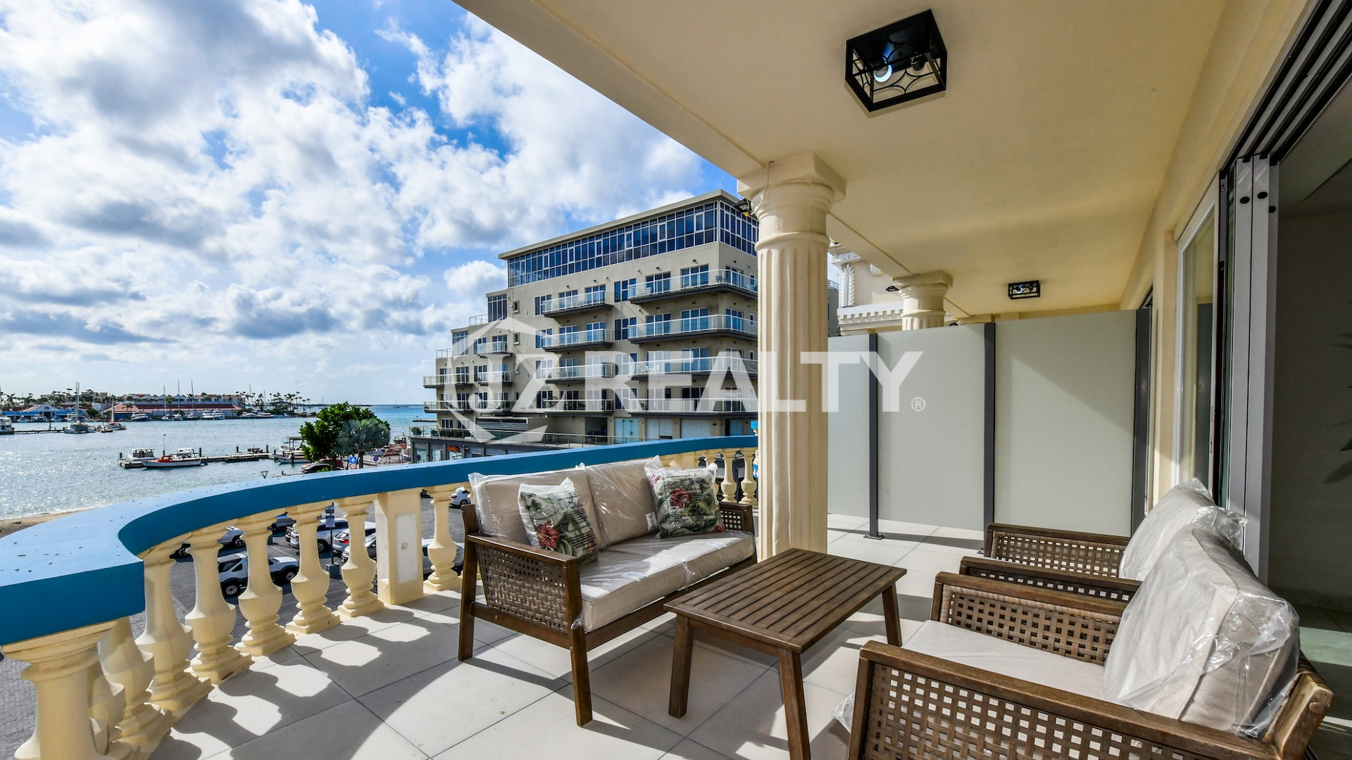condo 314 balcony with wicker seating and marina views