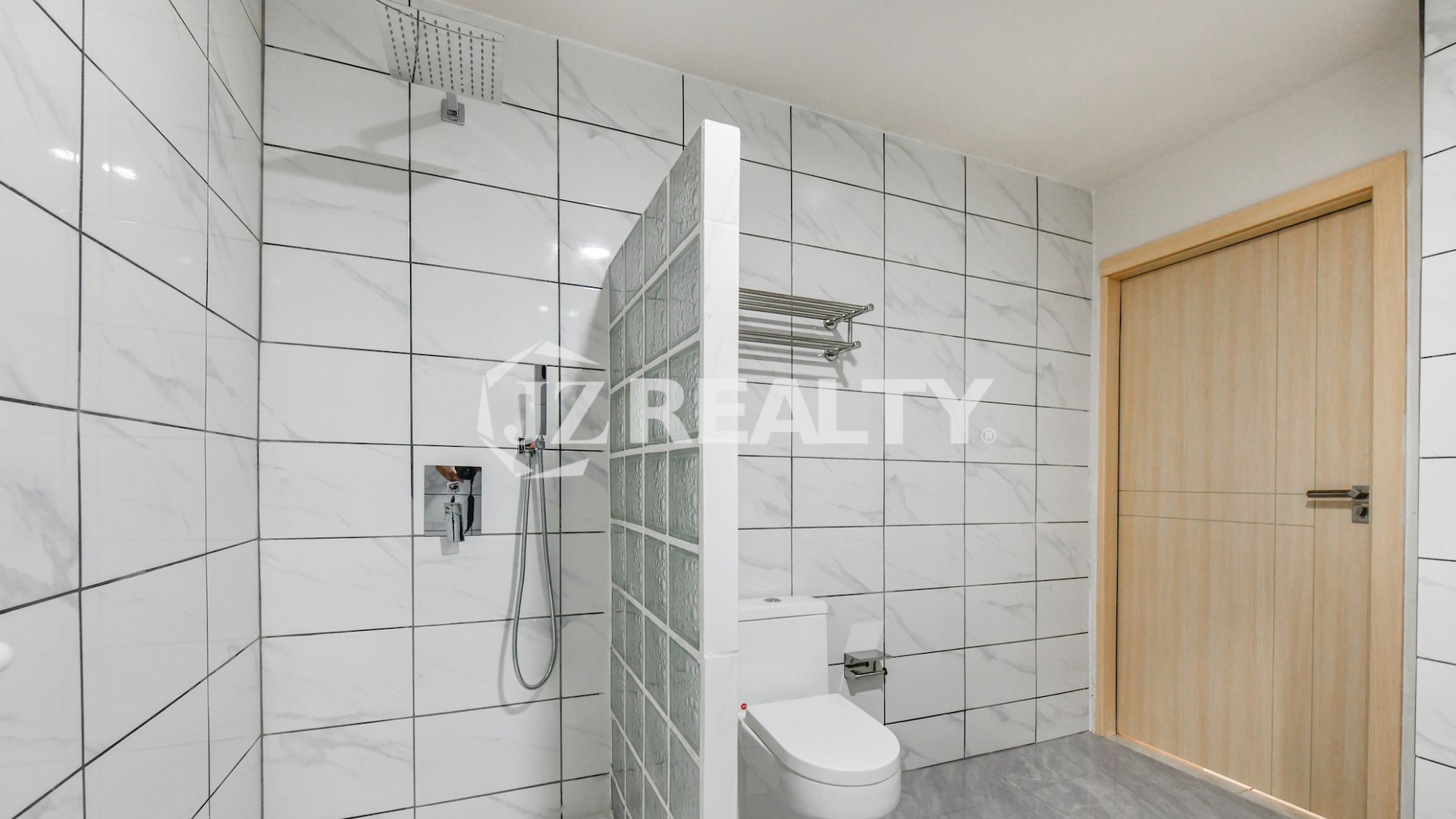 condo 315 Luxury bathroom with walk-in shower featuring glass block wall
