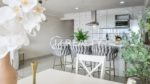 condo 315 open kitchen with bar seating and gray stools