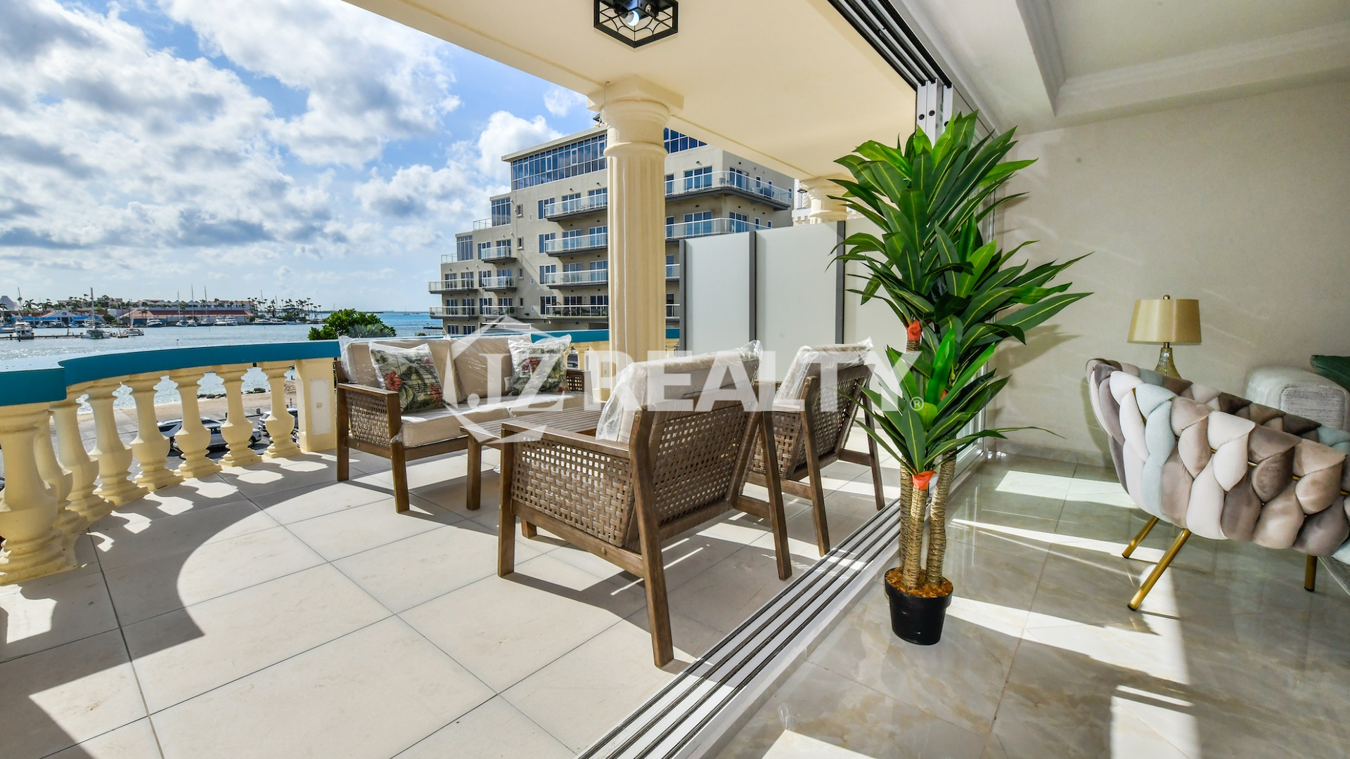 condo 318 balcony with wicker seating and marina views