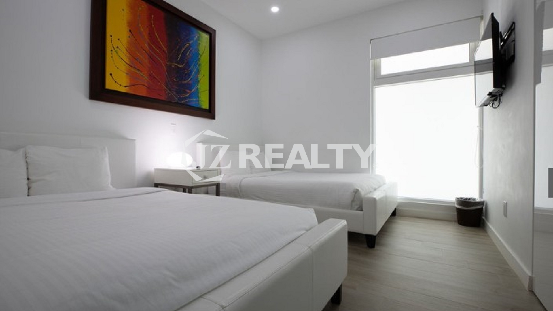 Condo 2-Bedroom Unit Blue Aruba double bedroom with modern decor