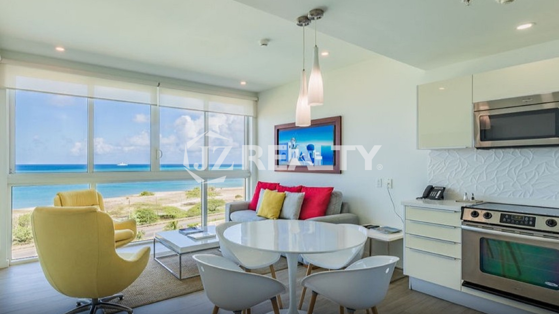 Condo 2-Bedroom Unit Blue Aruba living room and kitchen with ocean view