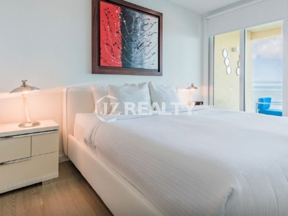 Condo 2-Bedroom Unit Blue Aruba master bedroom with sea view balcony